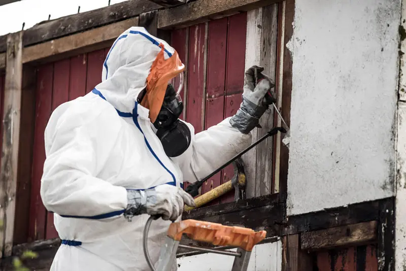 Asbestos ceiling removal team working in London home